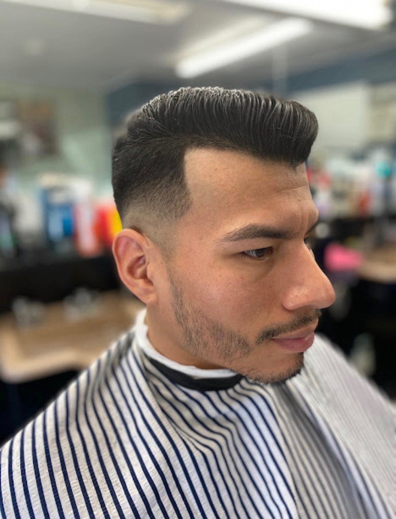 Sharp fade and styled top at Dapper B's Barbershop